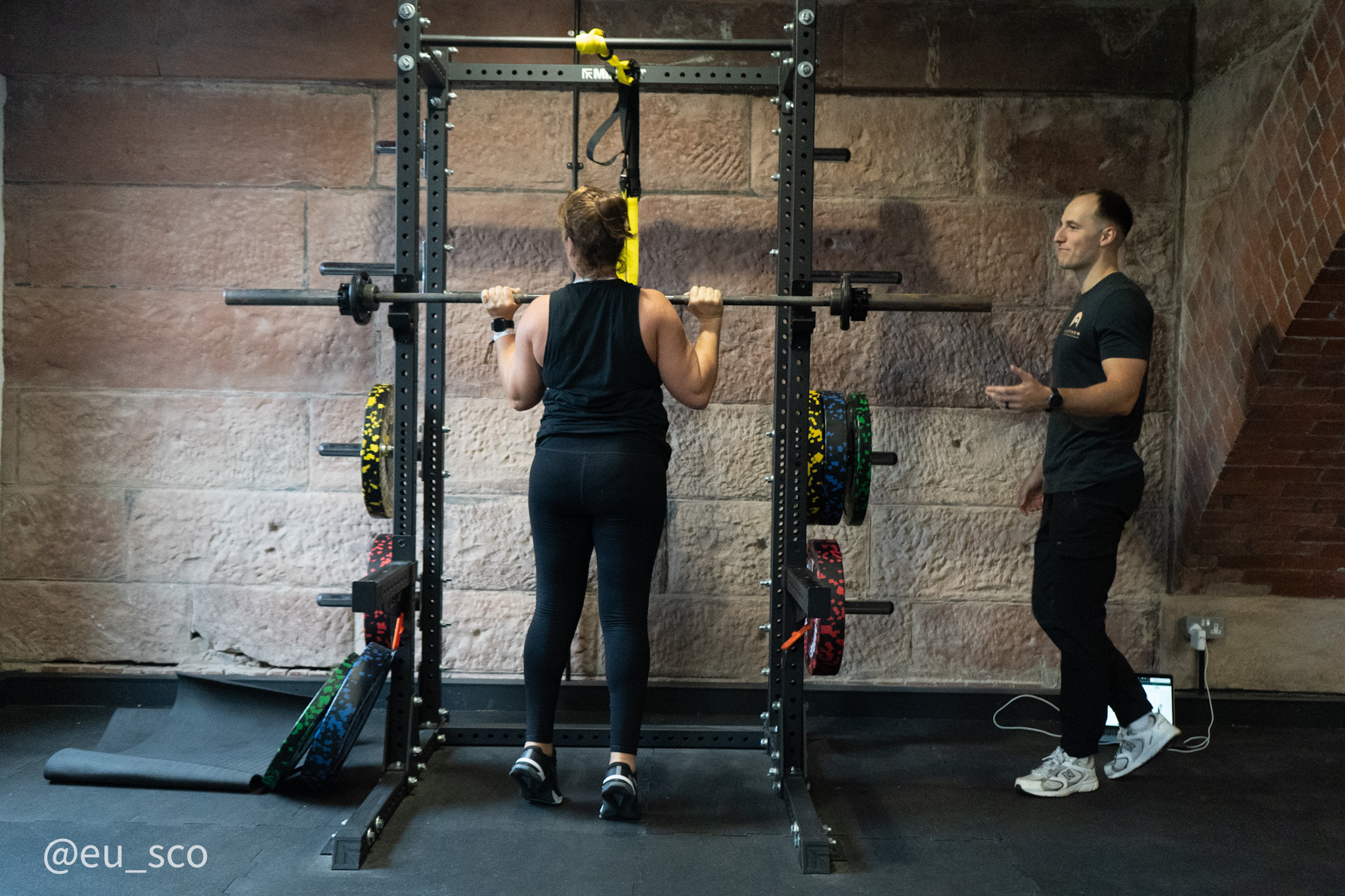 Personal trainer coaching a client through a strength exercise at Platform Health and Fitness, Edinburgh